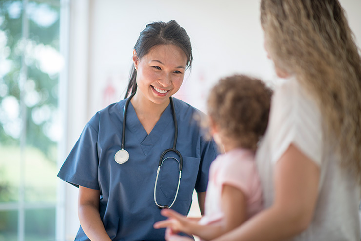 Nurse-Speaking-to-a-Mother-and-Child